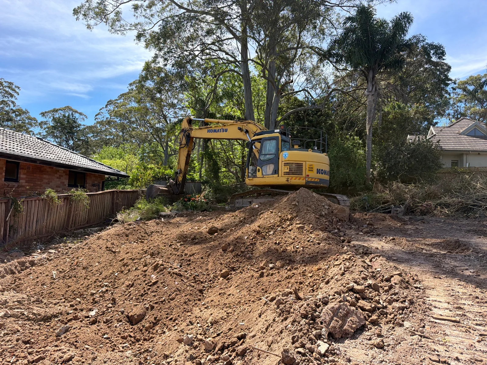 Excavator and cleared demolition area at 3 Amesbury Avenue · 2026-09-30