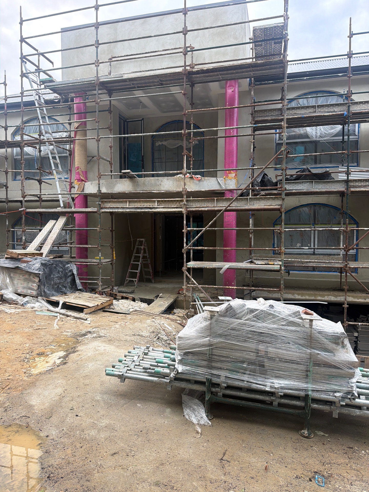 Exterior wall work, protected windows and scaffolding at 1 Toolang Road.