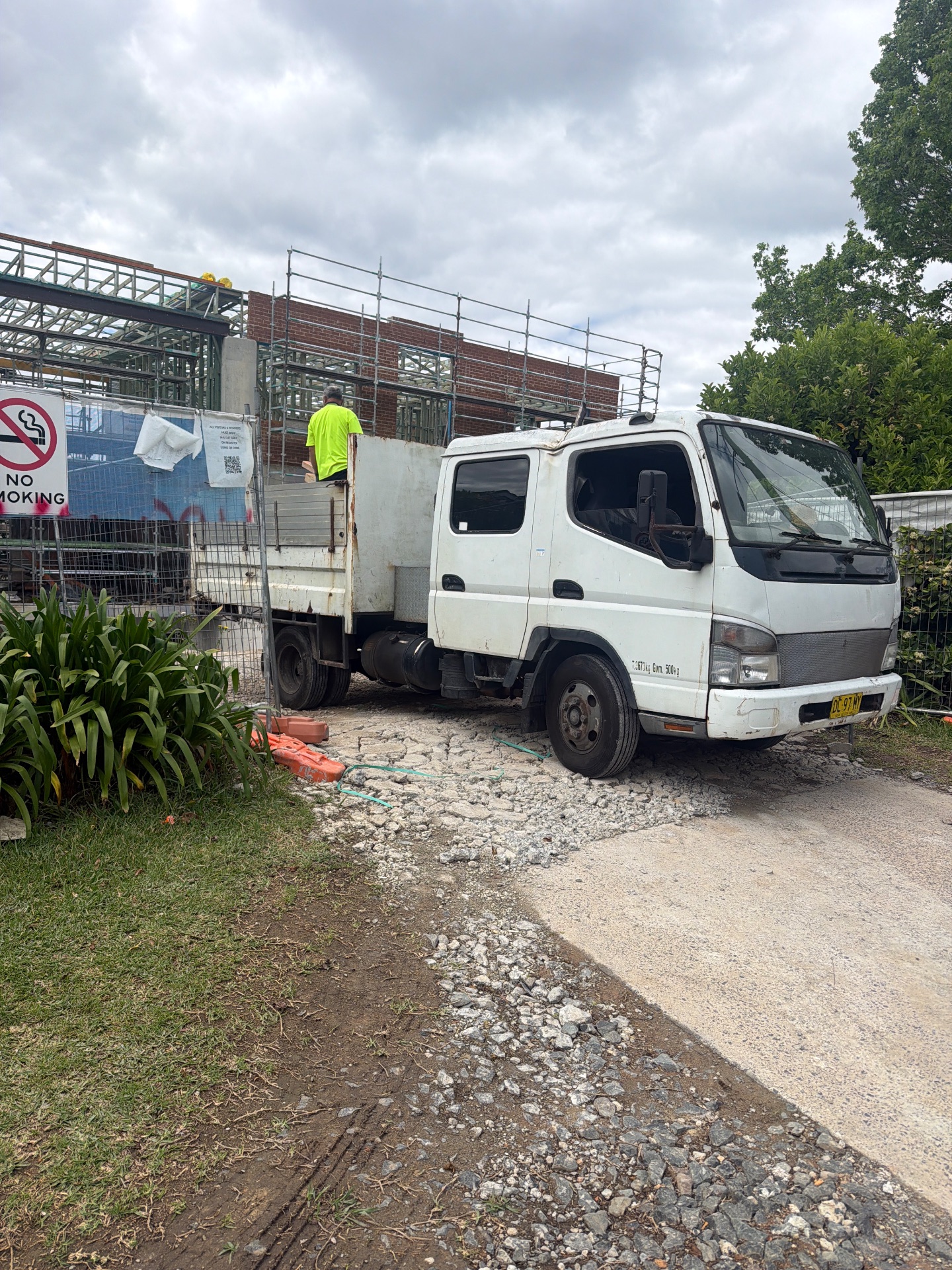 Brickwork, structural framing, scaffolding and a site vehicle at 10 College Crescent.