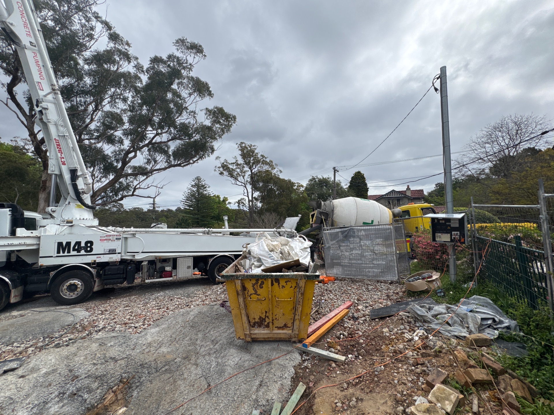 Concrete pump, mixer truck and site equipment at 12 Lennox Street.